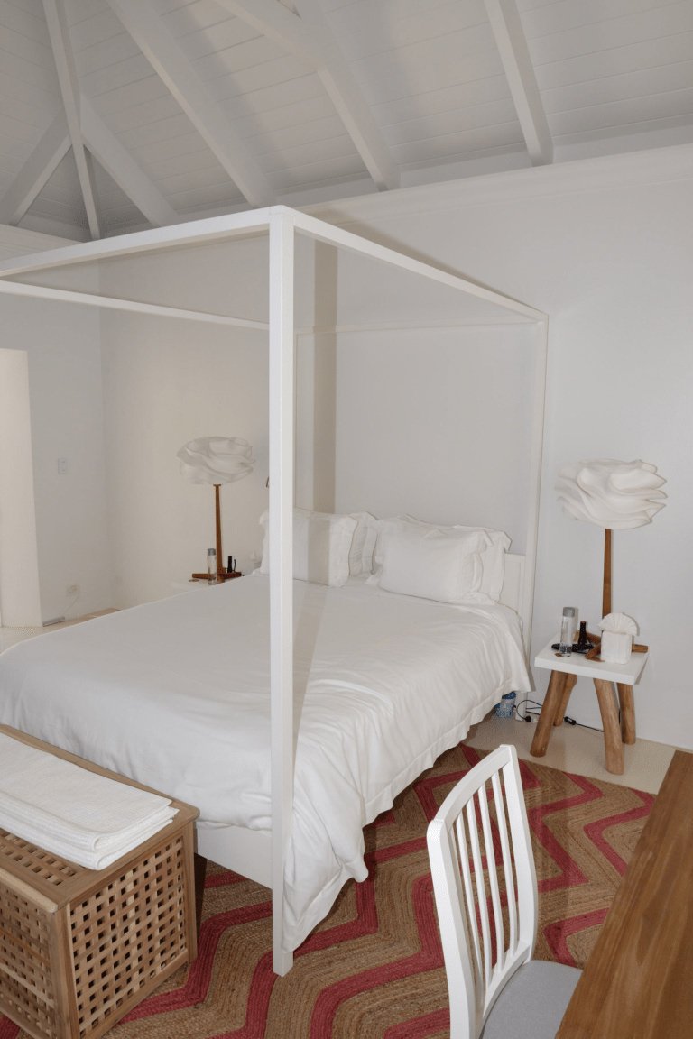 Light, breathable summer bedding in a bright bedroom